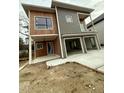 Modern two-story home with wood and gray siding, two-car garage, and a covered porch at 324 Waldo St, Cary, NC 27511