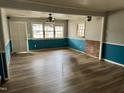 Living room with wood-look floors and brick fireplace at 3395 Nc Hwy 210, Smithfield, NC 27577