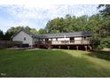Spacious backyard with large deck and hot tub at 3413 Thistledown Ct, Efland, NC 27243
