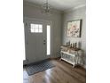 Elegant entryway with hardwood floors and art at 3601 River Watch Ln, Franklinton, NC 27525
