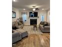 Spacious living room with fireplace and hardwood floors at 3601 River Watch Ln, Franklinton, NC 27525