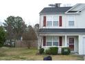Charming two-story home with a landscaped yard and a cozy front porch entrance at 4809 Kaycee Ct, Raleigh, NC 27616