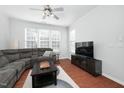 Spacious living room with hardwood floors and large windows at 5314 Silver Moon Ln, Raleigh, NC 27606