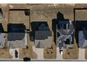 Aerial view of houses with gray roofs and solar panels at 897 Golden Plum Ln, Zebulon, NC 27597