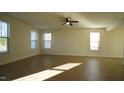 Spacious living room with hardwood floors and lots of natural light at 897 Golden Plum Ln, Zebulon, NC 27597