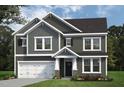 Two-story home with gray siding, white trim, and a two-car garage at 147 Charlotte Knoll St # 14, Zebulon, NC 27597