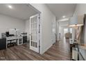 Home office with hardwood floors, built-in shelving, and French doors at 1007 Cherry Stem Rd, Haw River, NC 27258