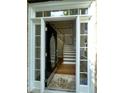 Elegant entryway featuring a hardwood staircase and a decorative glass front door at 112 Gingergate Dr, Cary, NC 27519