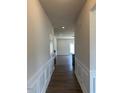 Entryway featuring hardwood flooring and white trim throughout the house at 142 Vega Loop, Sanford, NC 27330