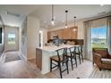 Modern kitchen with an island and stainless steel appliances at 142 Vega Loop, Sanford, NC 27330