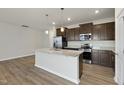 Modern kitchen with stainless steel appliances and granite countertops at 21 Nettle Ln # 252, Clayton, NC 27520