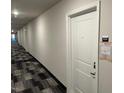 Modern hallway with neutral colored walls and carpet at 2225 Gathering Square Ct # 2225, Fuquay Varina, NC 27526
