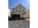 New construction two-story home featuring a covered porch and an attached two-car garage awaiting completion at 2417 Englemann Dr # 118, Apex, NC 27502