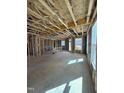 Unfinished living space with wood framework, stud walls, and large windows allowing ample natural light at 2417 Englemann Dr # 118, Apex, NC 27502