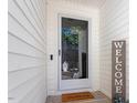 Front door entrance with a wreath and welcome mat at 3018 E Cotton Gin Dr, Clayton, NC 27527