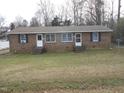 Front view of a brick duplex with two units and a grassy yard at 512 E Branch St, Spring Hope, NC 27882