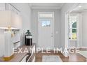 Bright and spacious entryway with hardwood floors and stylish decor at 54 Cultivator Ct, Angier, NC 27501