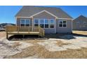 Spacious backyard featuring a wooden deck, perfect for outdoor entertaining at 82 N Stagecoach Dr, Wendell, NC 27591