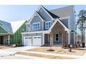 Beautiful two-story home featuring a two-car garage and well-maintained landscaping at 121 Big Bradley Way, Wendell, NC 27591