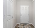 Bright entryway with white doors and wood-look flooring at 131 Kinnakeet Dr, Durham, NC 27704