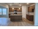 Stylish kitchen boasts a center island, stainless steel appliances, and ample cabinet space at 139 Grove Township Way, Angier, NC 27501