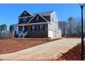 Two-story home with driveway and attached garage at 1410 Reading Ct # 92Kl, Burlington, NC 27217