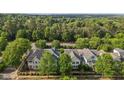 Serene aerial view showcases lush trees surrounding beautifully designed townhomes at 1703 Happiness Hill Ln, Raleigh, NC 27614