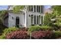 Attractive two-story home with blue shutters, arched windows, and well-maintained landscaping at 1703 Happiness Hill Ln, Raleigh, NC 27614