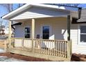 Inviting front porch with wooden railings, creating a welcoming entryway at 1723 Oklahoma Ave, Burlington, NC 27217