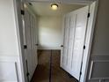 Office or flex space featuring double doors, neutral walls and carpeted floors at 19 E American Marigold Dr # 34, Benson, NC 27504