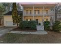 Two-story house with front porch, attached garage, and landscaping at dusk at 2010 Brass Ct, Franklinton, NC 27525