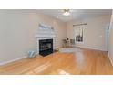 Living room with hardwood floors, fireplace, and window at 2010 Brass Ct, Franklinton, NC 27525