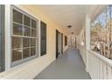 Covered porch with gray floor and white railings at 2010 Brass Ct, Franklinton, NC 27525