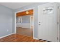 Entryway with hardwood floors and view into the living room at 2041 Grassy Creek Virgilina Rd, Oxford, NC 27565