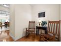 Bright entryway with hardwood floors and rocking chairs at 2118 Stoney Spring Dr, Raleigh, NC 27610