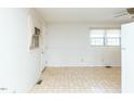 View of kitchen area with tile floor and white cabinets at 301 King Arthur Trl, Garner, NC 27529