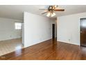 Hardwood floor living room with ceiling fan at 301 King Arthur Trl, Garner, NC 27529
