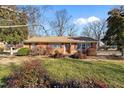Brick ranch house with a spacious yard at 307 E Jackson St, Mebane, NC 27302