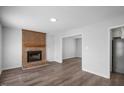 Living room featuring a brick fireplace and hardwood floors at 5321 Baywood Forest Dr, Knightdale, NC 27545