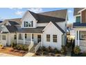 Charming two-story farmhouse with gray roof and white siding at 547 Vine Pkwy, Pittsboro, NC 27312