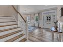 Bright and spacious entryway with hardwood floors and a staircase at 63 Eastland Ct, Smithfield, NC 27577
