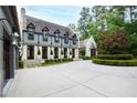 House exterior showcasing a circular driveway and landscaping at 805 Pinehurst Dr, Chapel Hill, NC 27517