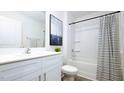 Clean bathroom with white vanity and tub shower at 858 Forth Ct, Gibsonville, NC 27249