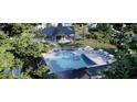 Relaxing pool area with lounge chairs and cabanas at 148 Charlotte Knoll St # 8, Zebulon, NC 27597