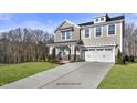Two-story home with gray siding, white trim, and a two-car garage at 178 Charlotte Knoll St # 9, Zebulon, NC 27597