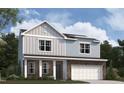 Two-story house with gray siding, stone accents, and a two-car garage at 108 Gabriel Ct, Clayton, NC 27520