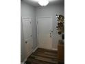 Bright entryway with white door and wood-look floors at 113 Pelsett St, Durham, NC 27703