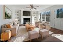 Virtually staged living room with fireplace and built in shelving at 118 Trafalgar Ln, Cary, NC 27513