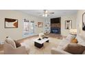 Inviting living room with brick fireplace, built-in shelving, and French doors leading to the outdoors at 1219 Carlton Ave, Burlington, NC 27217