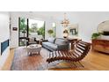 Spacious living room with hardwood floors and large windows at 202 Dundas Ln, Raleigh, NC 27603